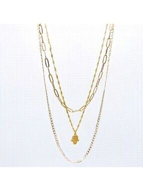 THREE layered necklaces with gold hamsa pendant.